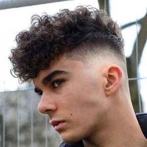 curly high top fade with side part