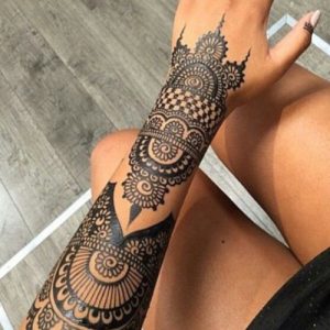 beautiful black henna tattoo design on hand