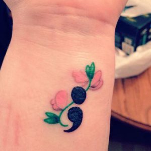colorful floral semicolon tattoo design