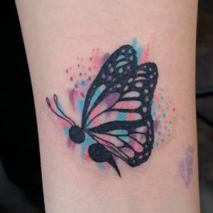 colorful watercolor semicolon butterfly tattoo on forearm