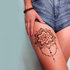 floral mehndi design henna flower tattoo on leg thigh for women
