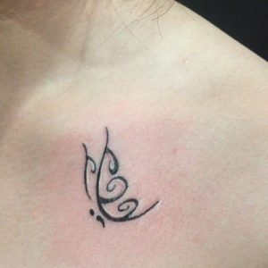 semicolon butterfly tattoo on chest