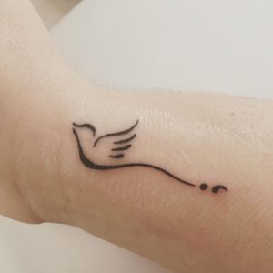 simple minimal semicolon bird tattoo designs